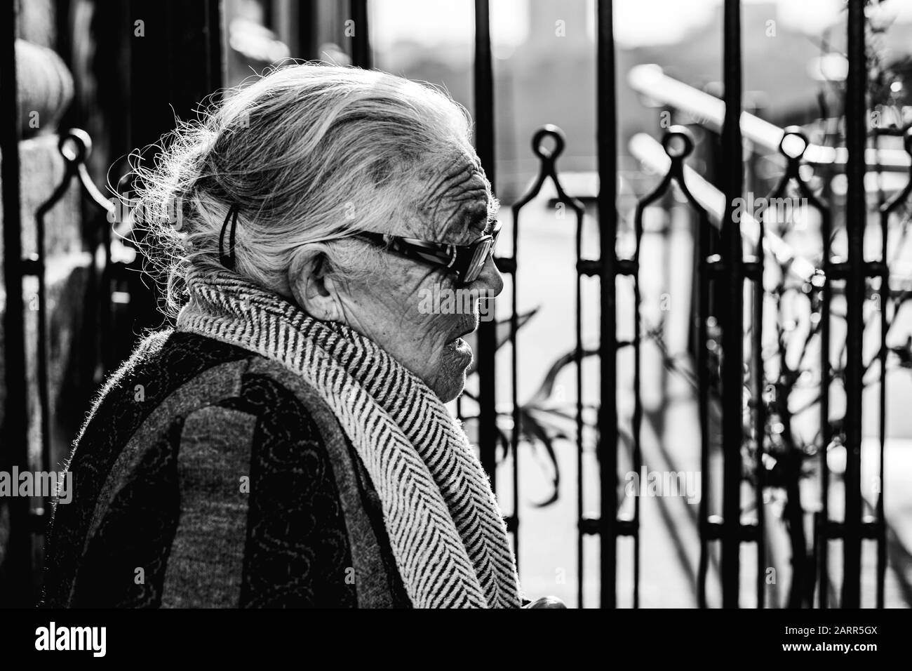 Porto / Portugal - Old woman and the cityscape. Black and white photo. Stock Photo