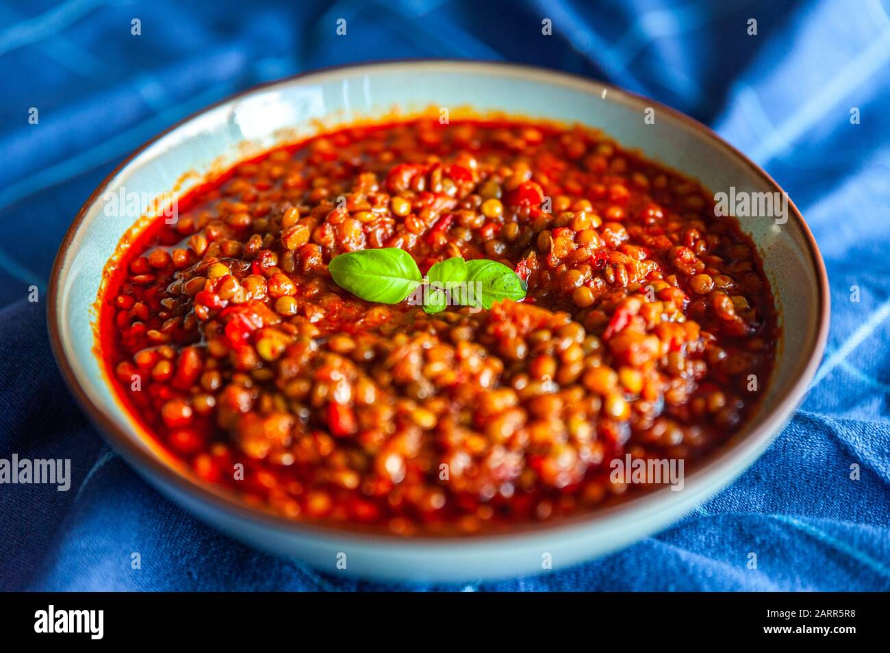 Traditional turkish lentil dish topped with herbs Stock Photo