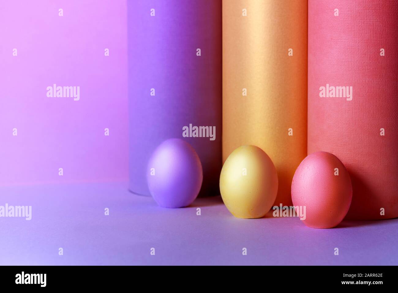 Colored Easter eggs with tubes made from craft paper. Ester concept. Stock Photo