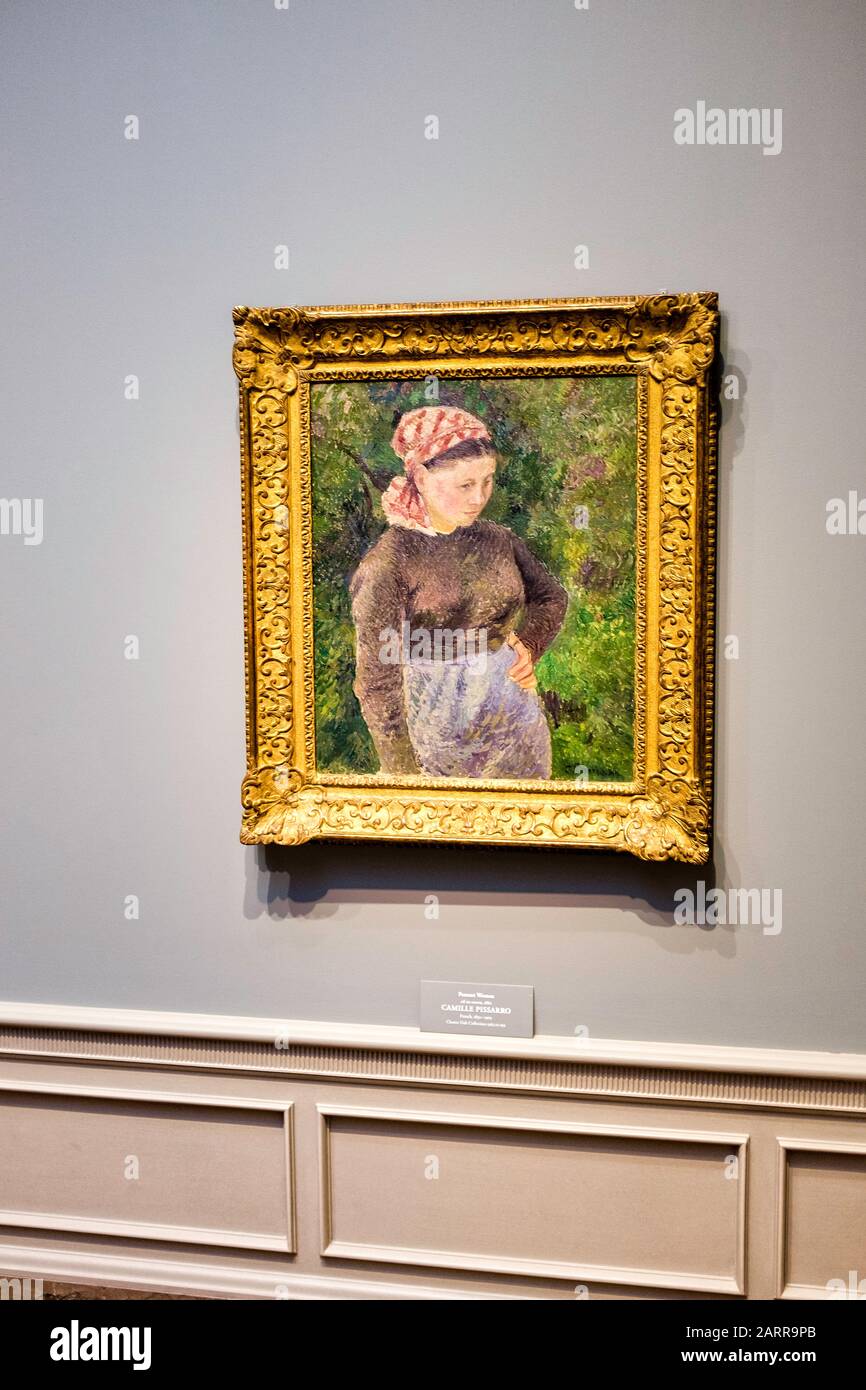 A framed Pissaro, oil on canvas, 'Peasant Woman', hanging at The National Gallery of Art, Waahington, D.C. Stock Photo