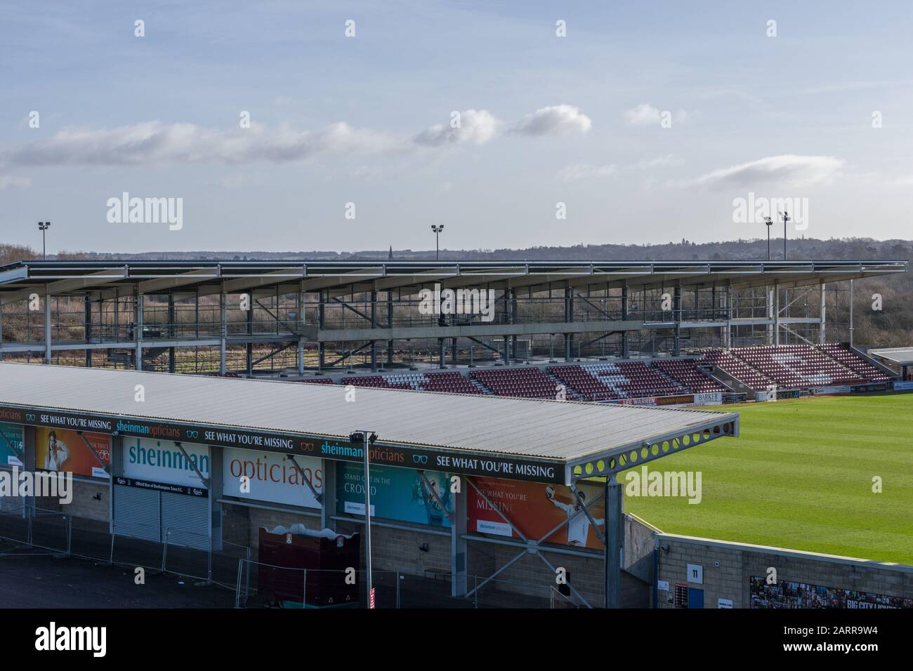 The PTS Academy Stadium, home of Northampton Town FC  , Sixfields, Northampton, UK; shows the controversial unfinished East Stand Stock Photo
