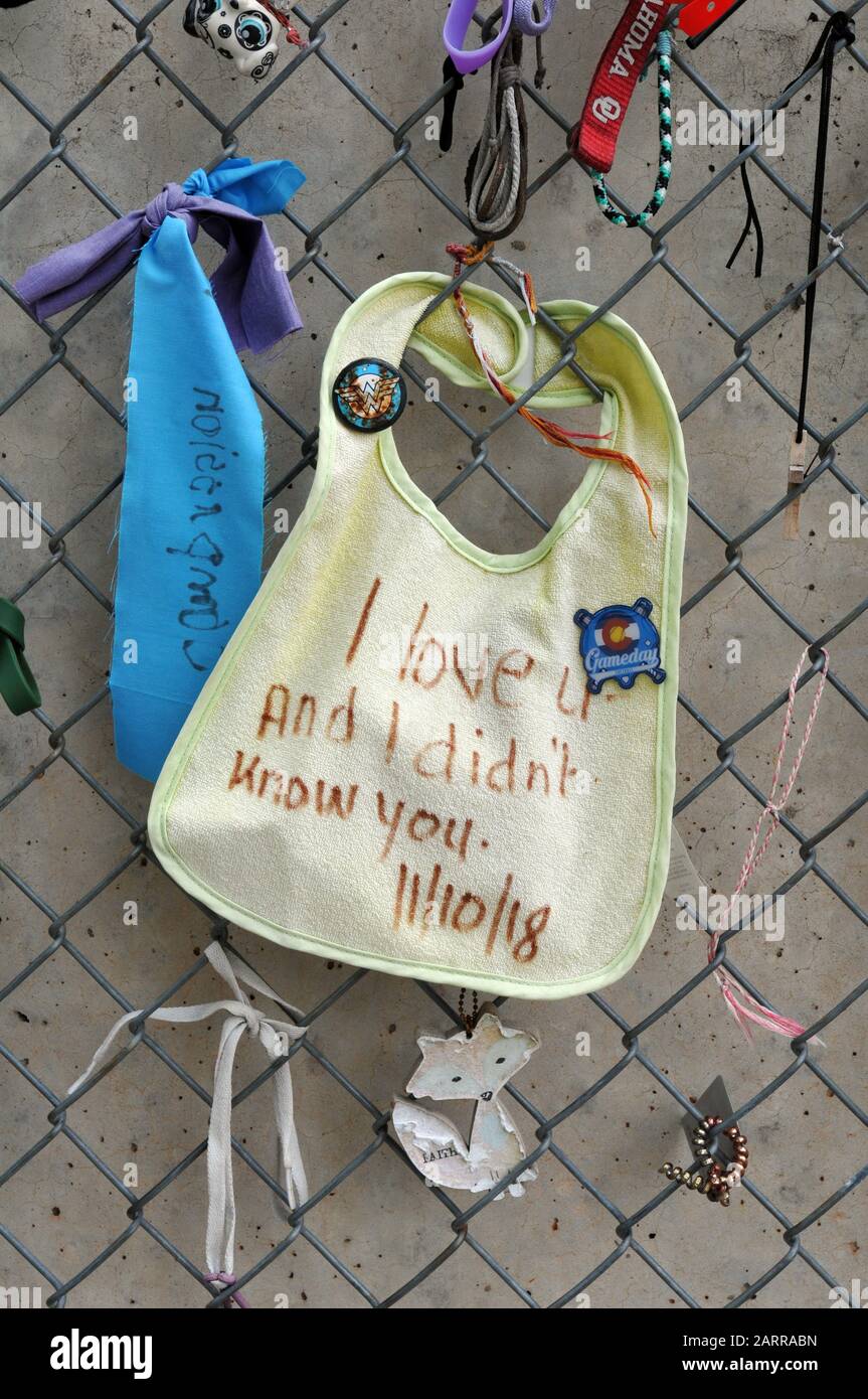 Objects left on a fence, now part of the Oklahoma City National Memorial, that originally protected the site of the 1995 bombing that killed 168. Stock Photo