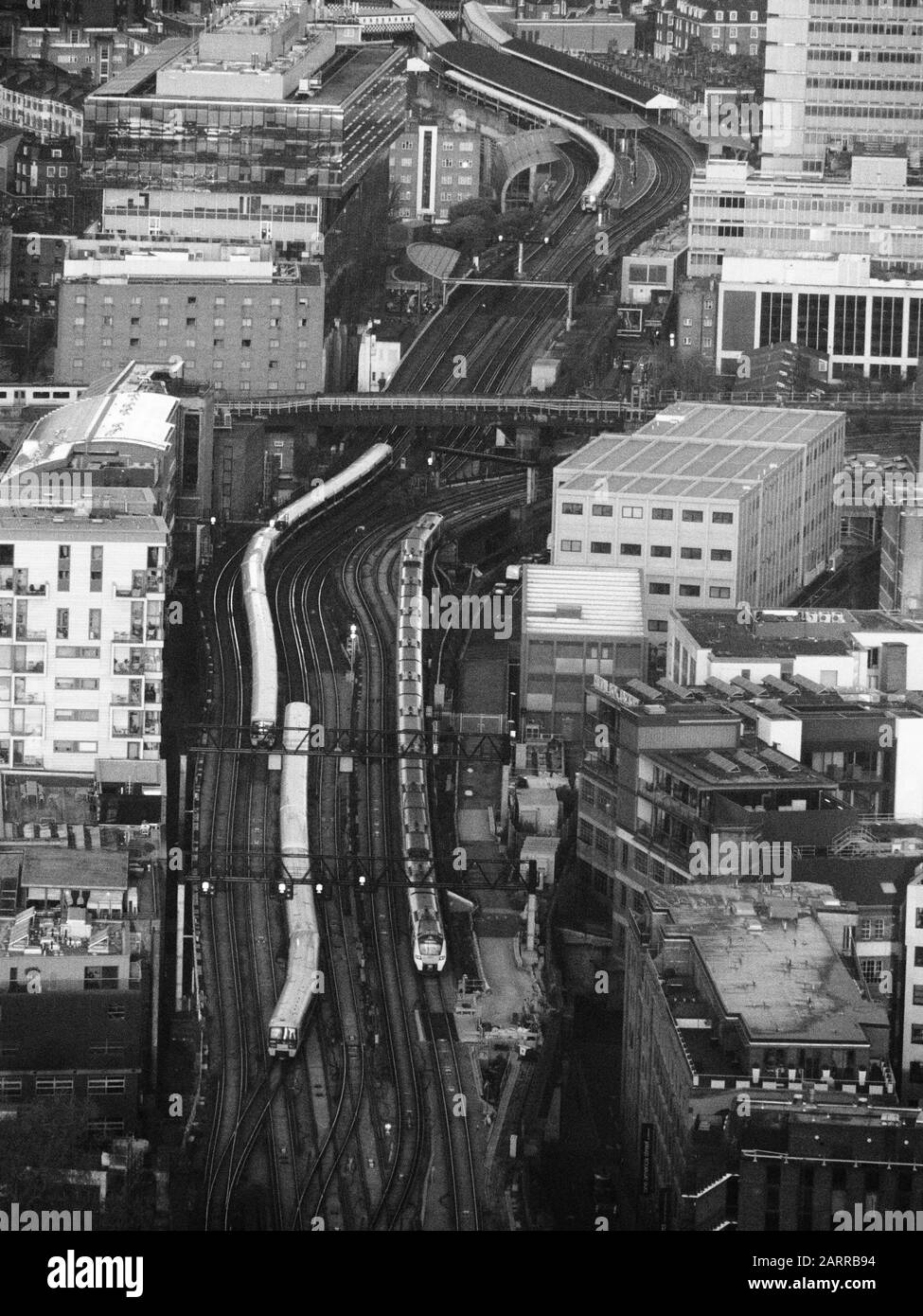an aerial view from the Shard of the railway lines leading from Waterloo East towards London Bridge station in monochrome, black and white Stock Photo