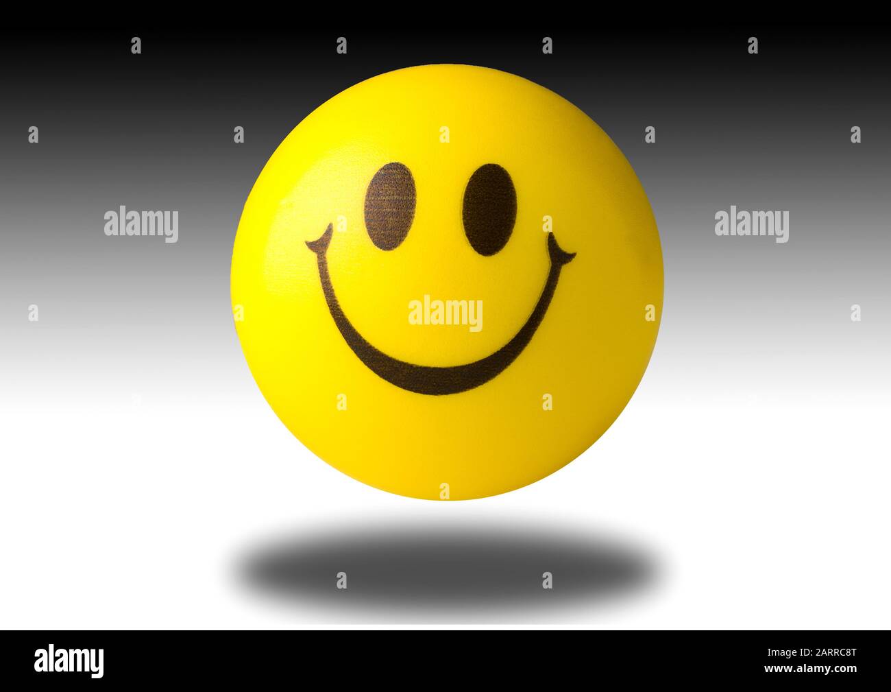 The famous Yellow Smiley Face Icon bouncing rubber ball portrait and landscape. Great for cut out vector Stock Photo
