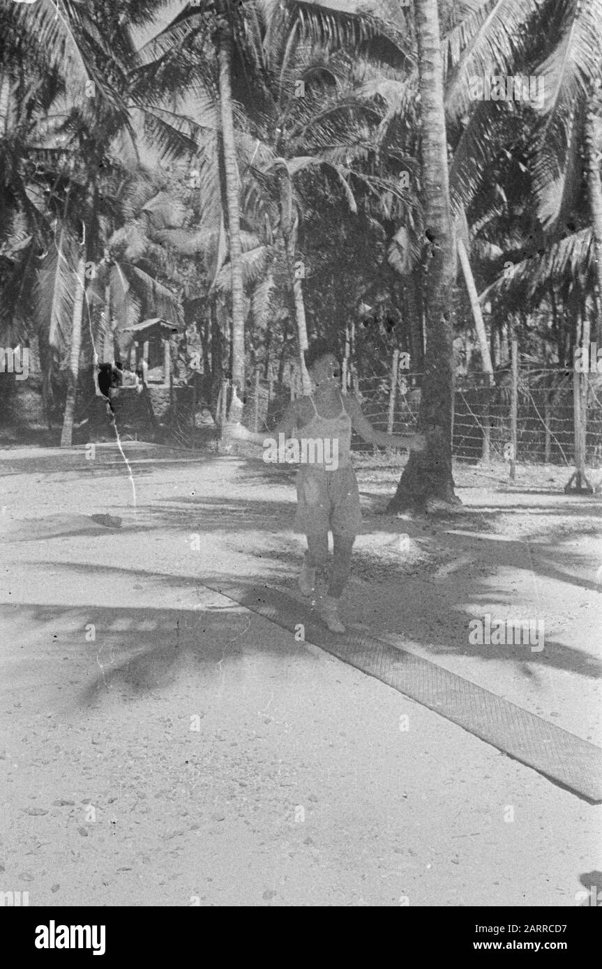 Internment Camps Sabang  Sabang: The TNI soldiers captured in the course of time, are housed in several internment camps. In the camps, these interns enjoy great freedom of movement. The former Olt. Aminoedin of the TNI tries to stay fit by jumping rope. Date: 4 January 1948 Location: Indonesia, Dutch East Indies, Sumatra Keywords: Indonesia, Dutch East Indies, Sabang Stock Photo