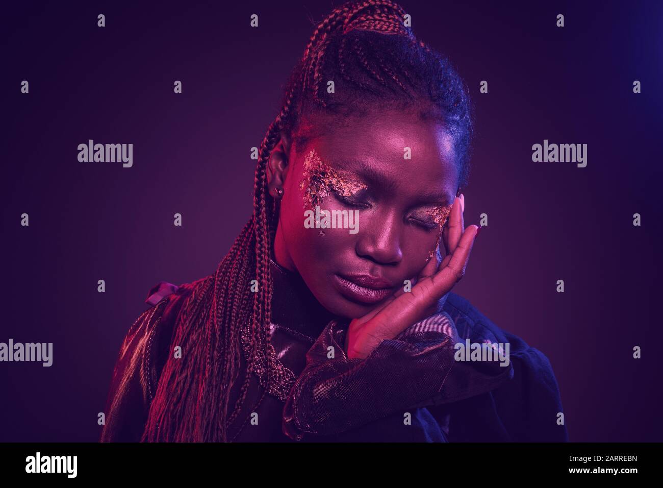 Young African Woman With Afro Hairstyle And Shiny Makeup Studio