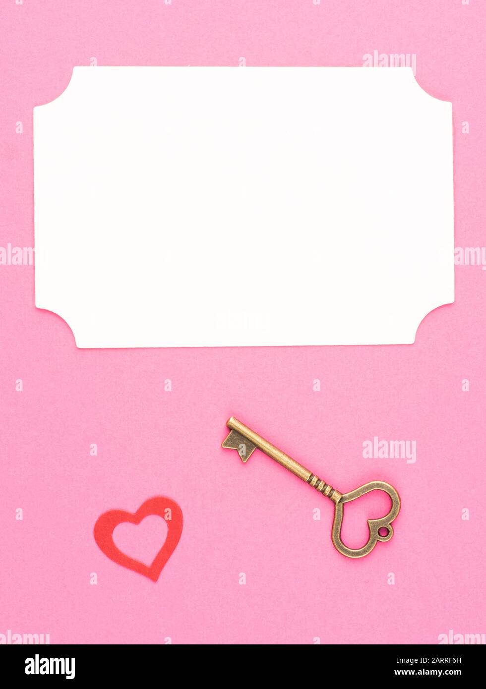 White plate for inscriptions, image of a heart and a vintage key on a ...