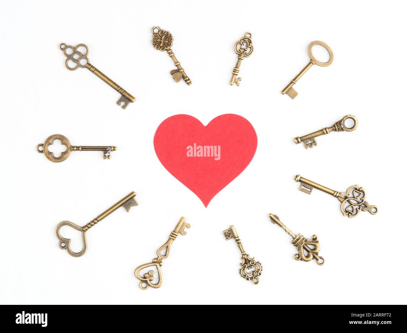 Bronze vintage keys around a red heart icon isolated on white Stock ...