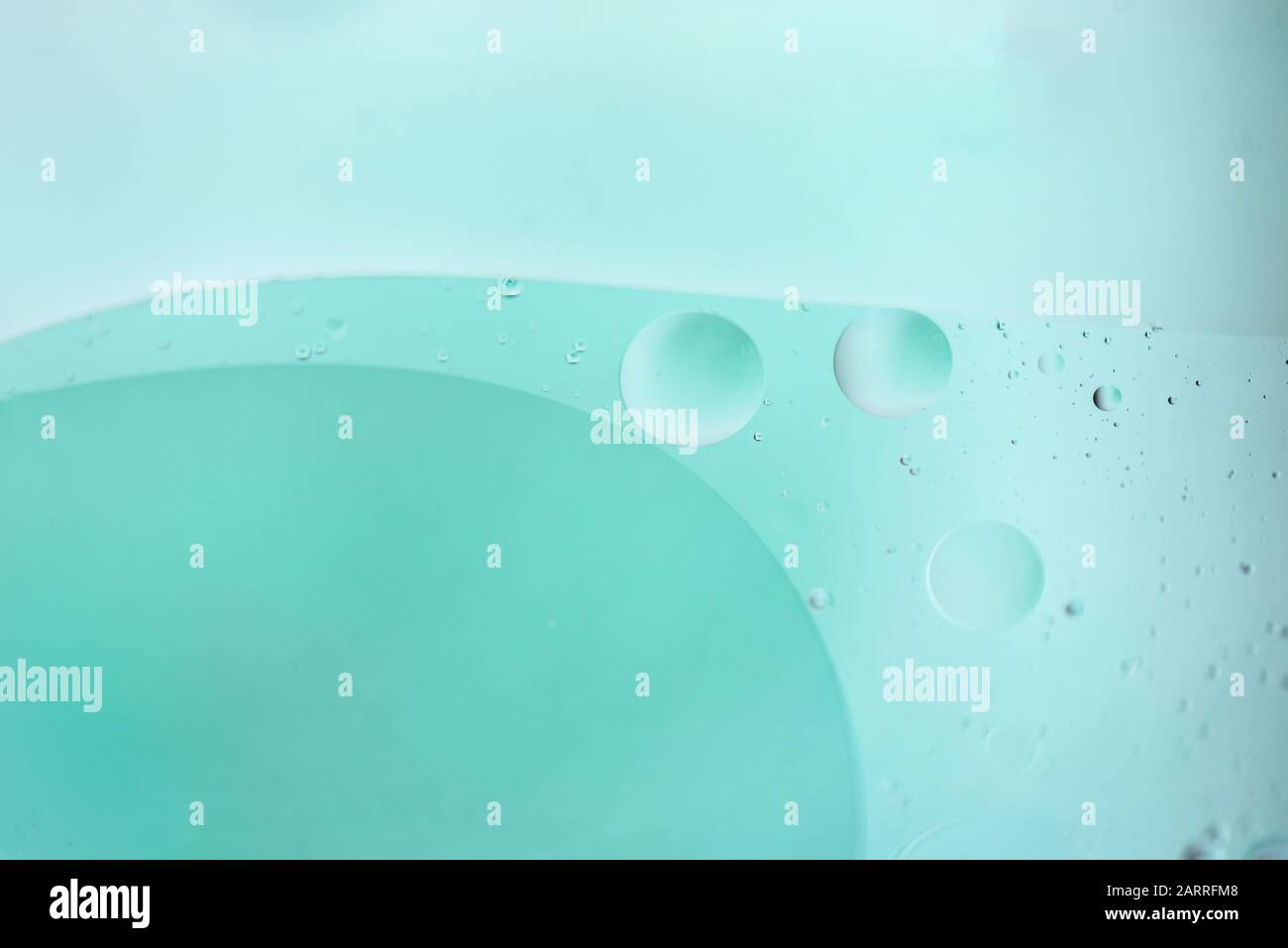 Light blue abstract background picture made with oil, water and soap ...