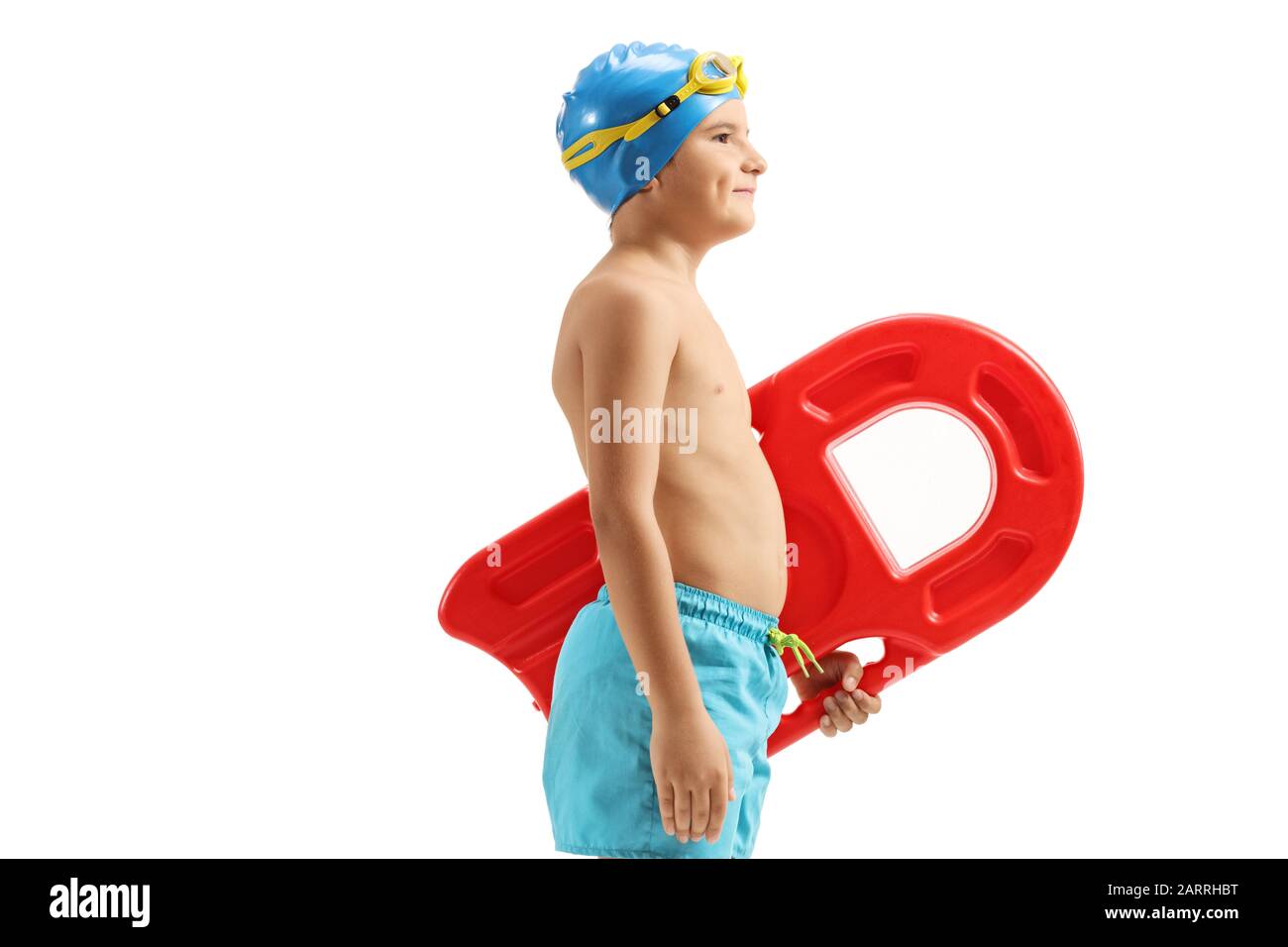 Boy in swimming trunks holding a swimming board isolated on white background Stock Photo