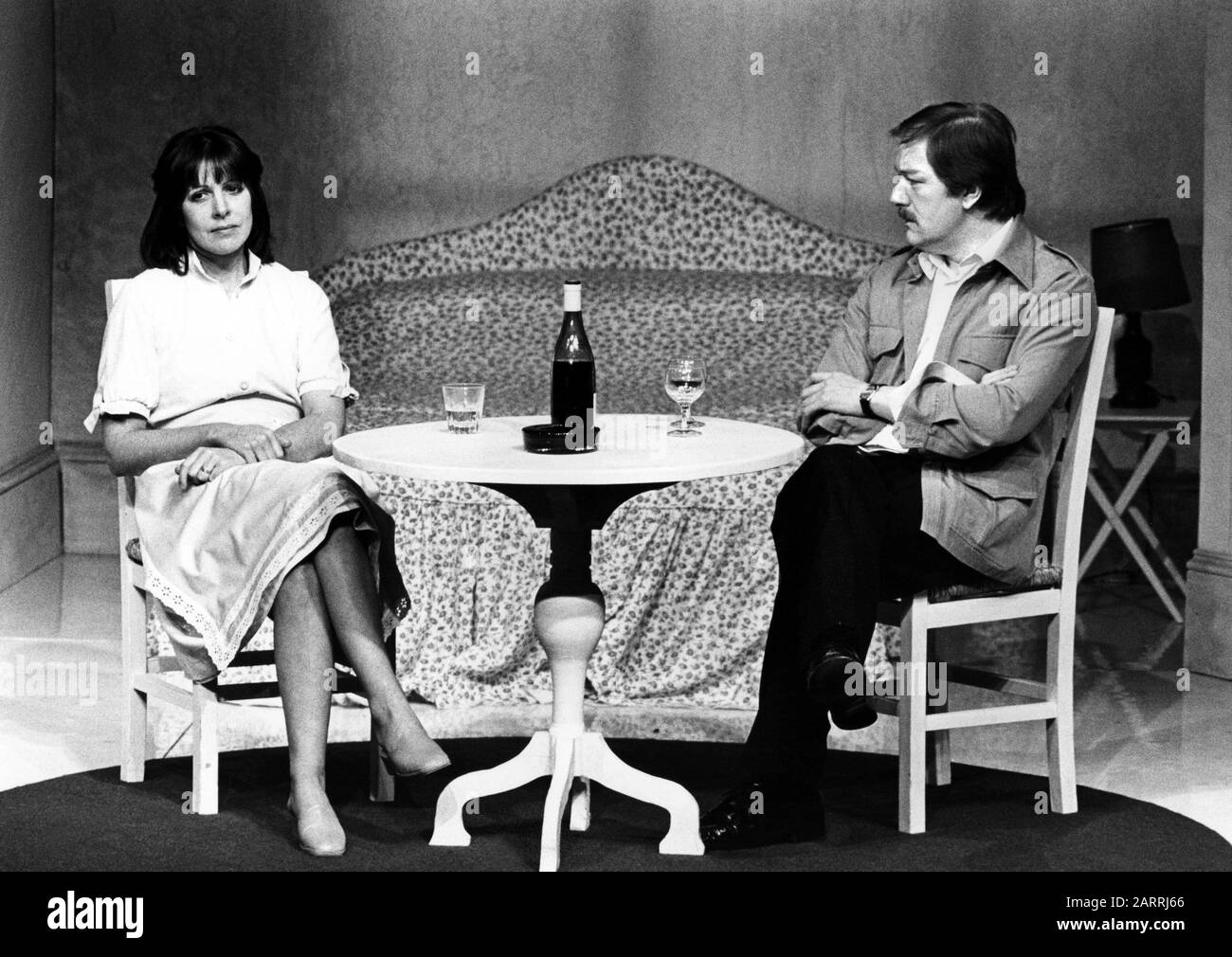 Penelope Wilton as Emma and Michael Gambon as Jerry in BETRAYAL by Harold Pinter directed by Peter Hall at the National Theatre (NT), London in 1978 . Sir Michael Gambon, born in Dublin 1940, moved to London at the age of 6, became a British citizen. Knighted in 1998. Multi-award-winner, including 3 Oliviers and 4 BAFTAs. Dame Penelope Wilton, born in Scarborough 1946. English stage, television and film actress. Awarded OBE in 2004 and DBE in 2016. Stock Photo