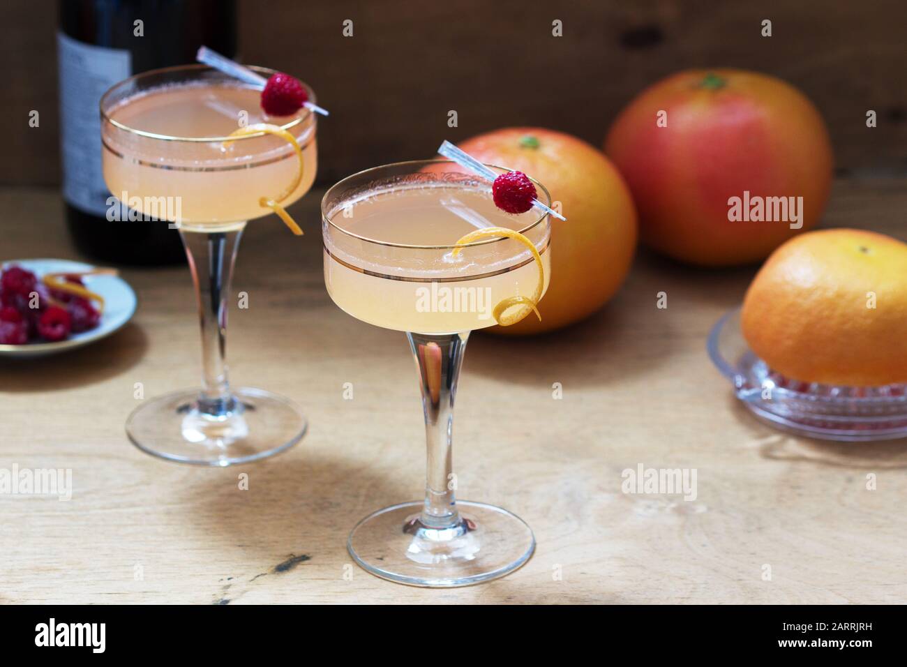 Champagne cocktail with grapefruit juice, garnished with zest and