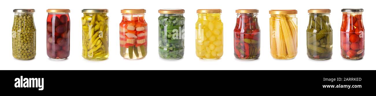 Jars with different canned vegetables on white background Stock Photo