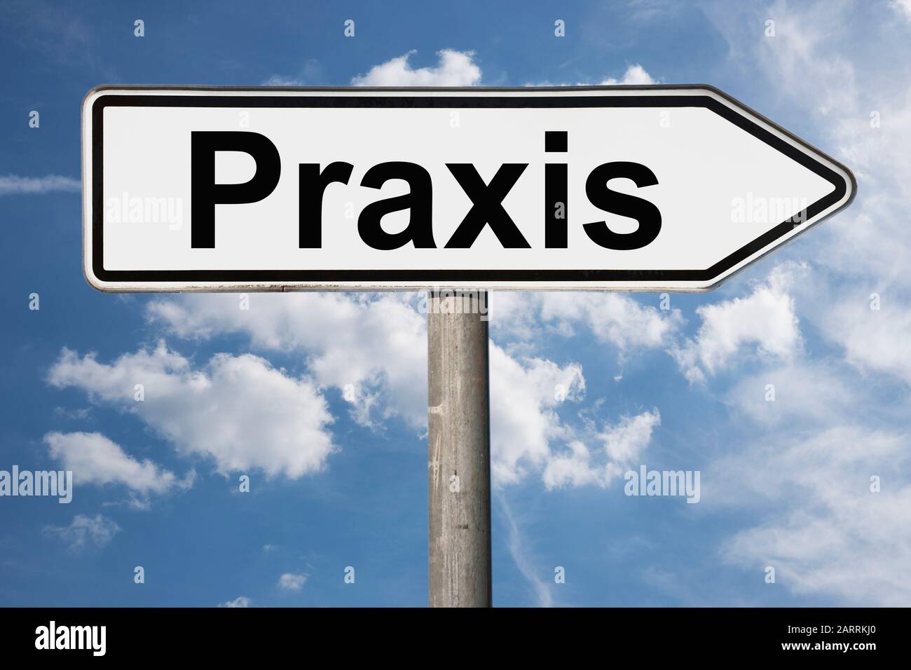 Detail photo of a signpost with the inscription Praxis (Surgery) Stock Photo