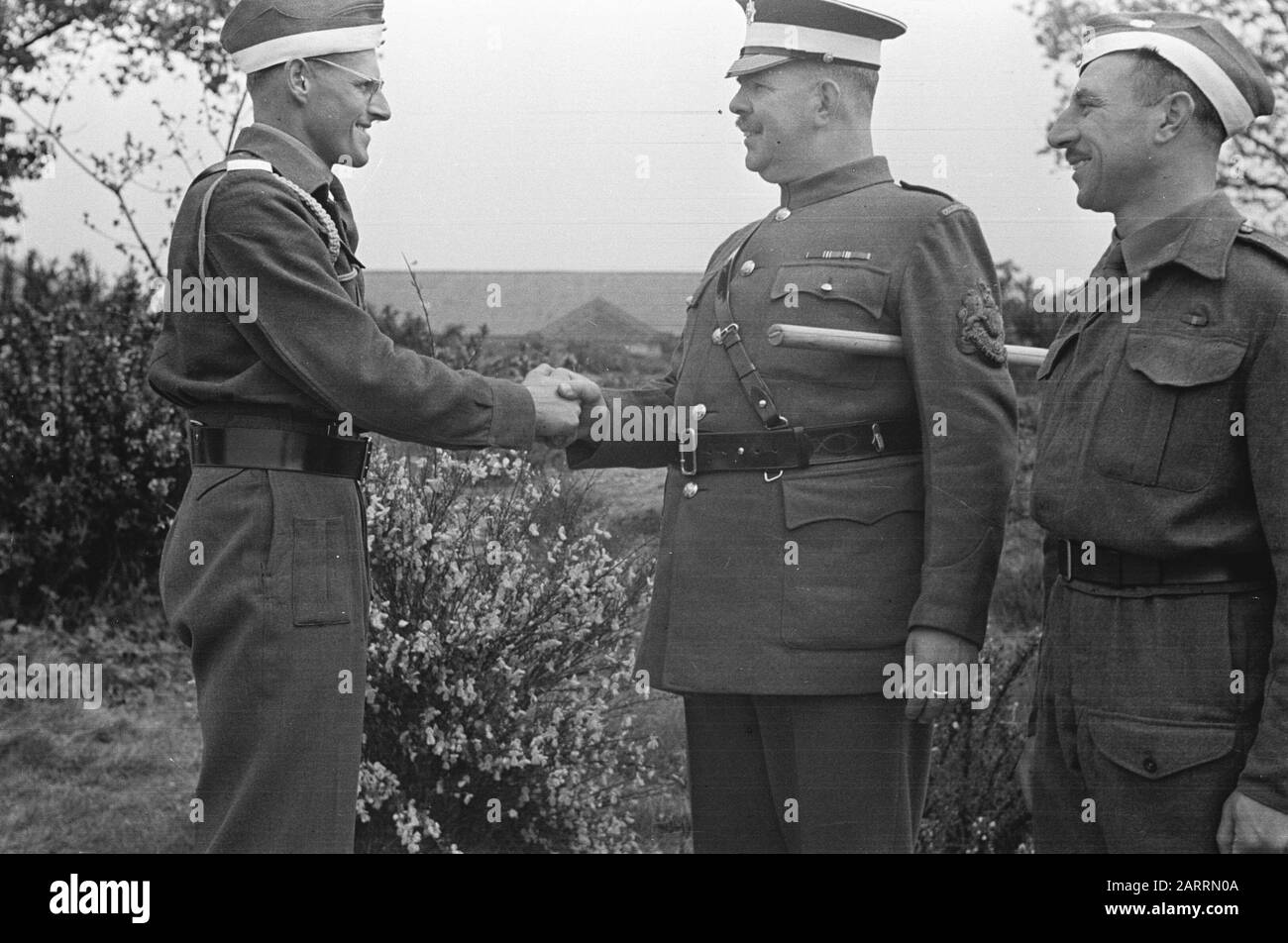 Series Octu-training at Aldershot for Dutch officers, together with British cadets. [Passing out of Dutch Cadets.20 Lt. Biyl congratulated by Sergt-Major on receipt of belt of Honor] Annotation: Probably Lieutenant Axe Date: May 1943 Location: Aldershot, Great Britain Keywords: army, soldiers, trainings, World War II Stock Photo