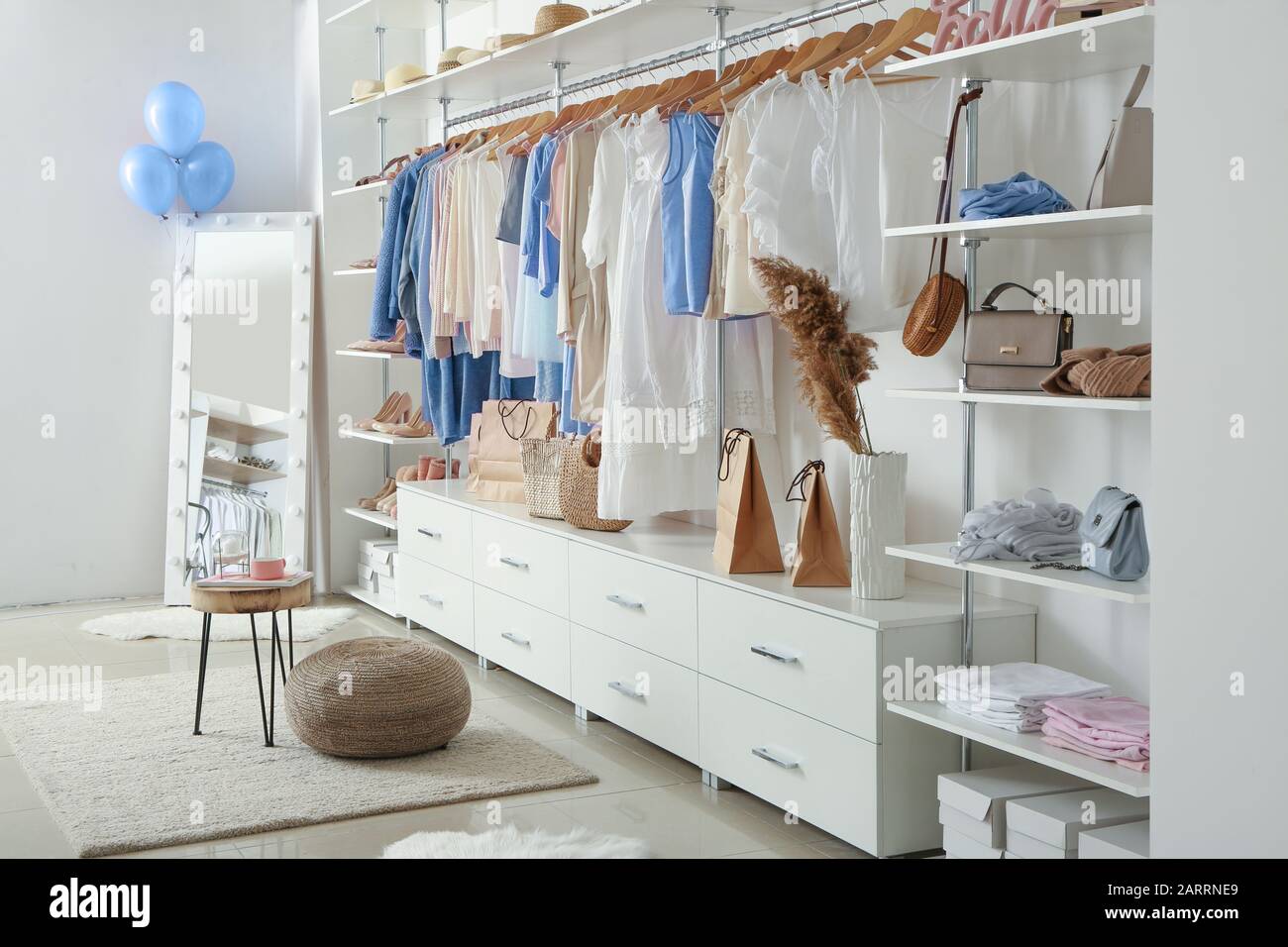 Interior Of Dressing Room With Stylish Clothes And Accessories