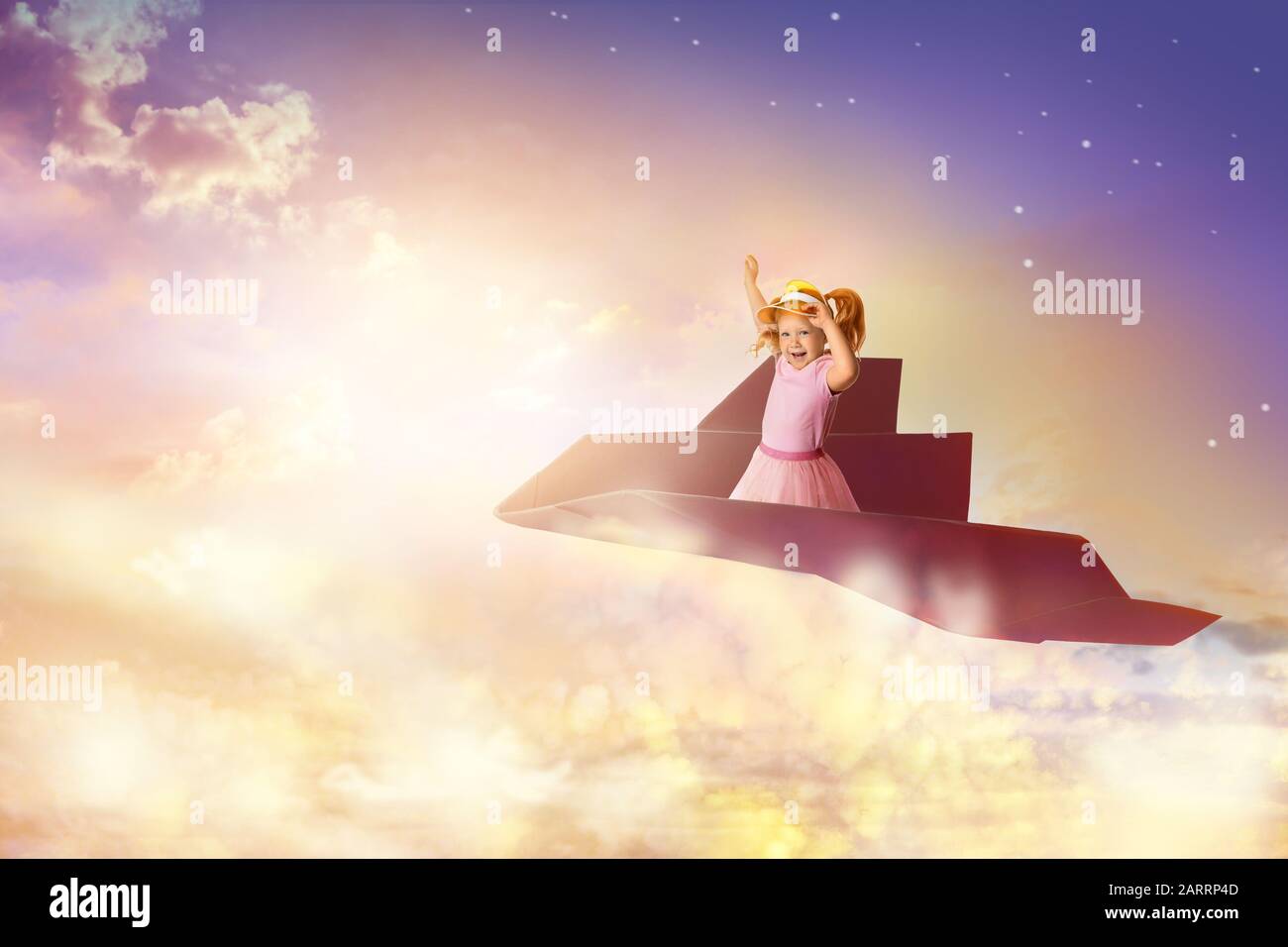 Cute little girl flying on origami airplane in beautiful sky Stock ...