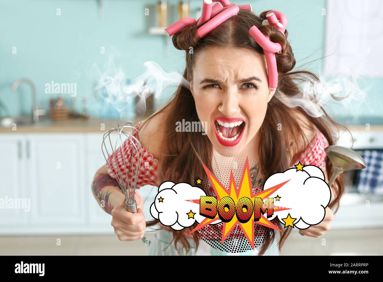 Funny angry housewife with steam coming out of ears in kitchen Stock Photo