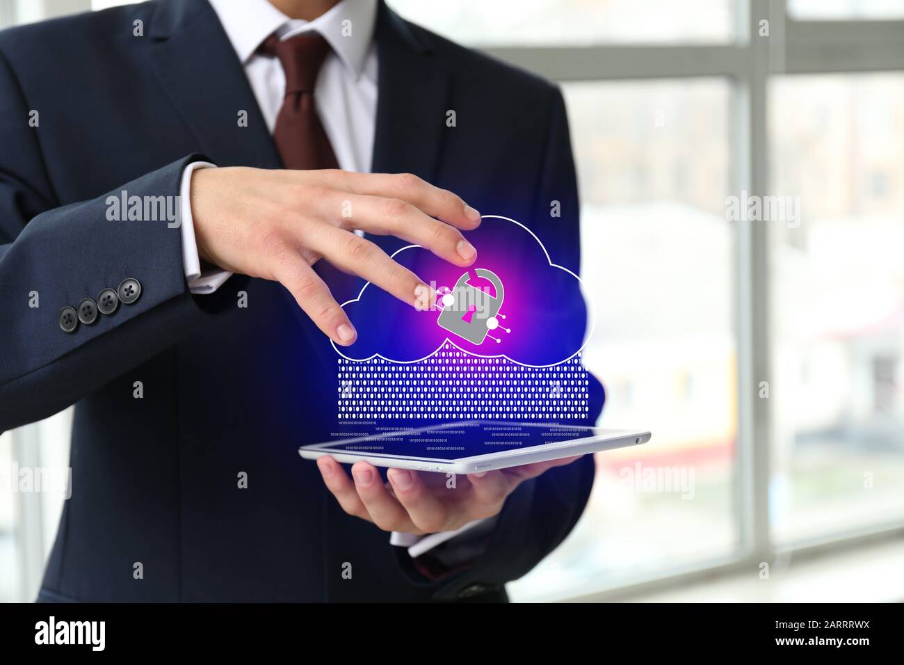 Businessman with tablet computer using cloud storage service in office, closeup Stock Photo