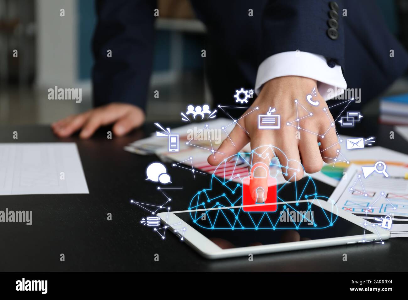 Businessman with tablet computer using cloud storage service in office, closeup Stock Photo