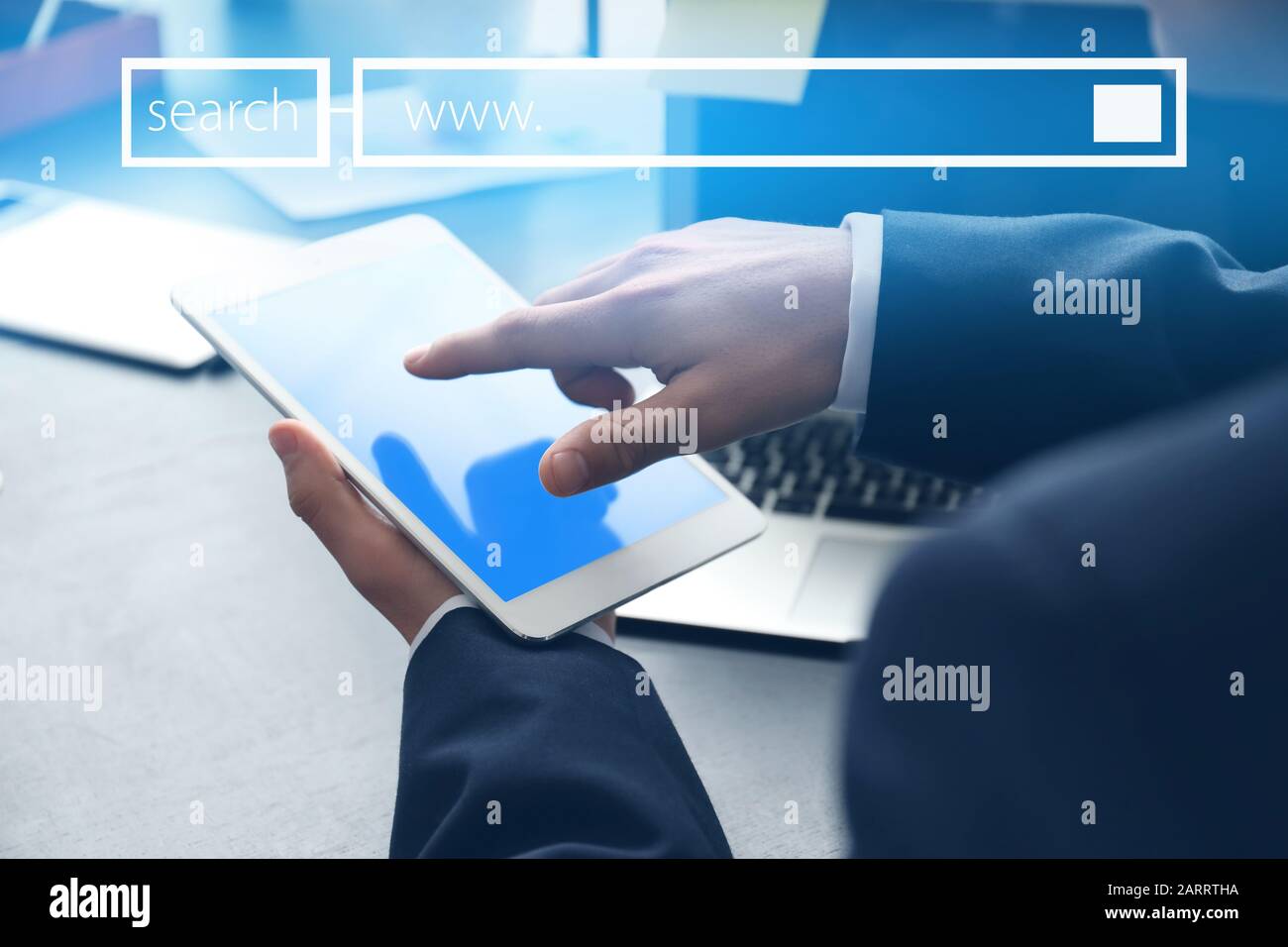 Businessman with tablet computer using web search engine in office, closeup Stock Photo