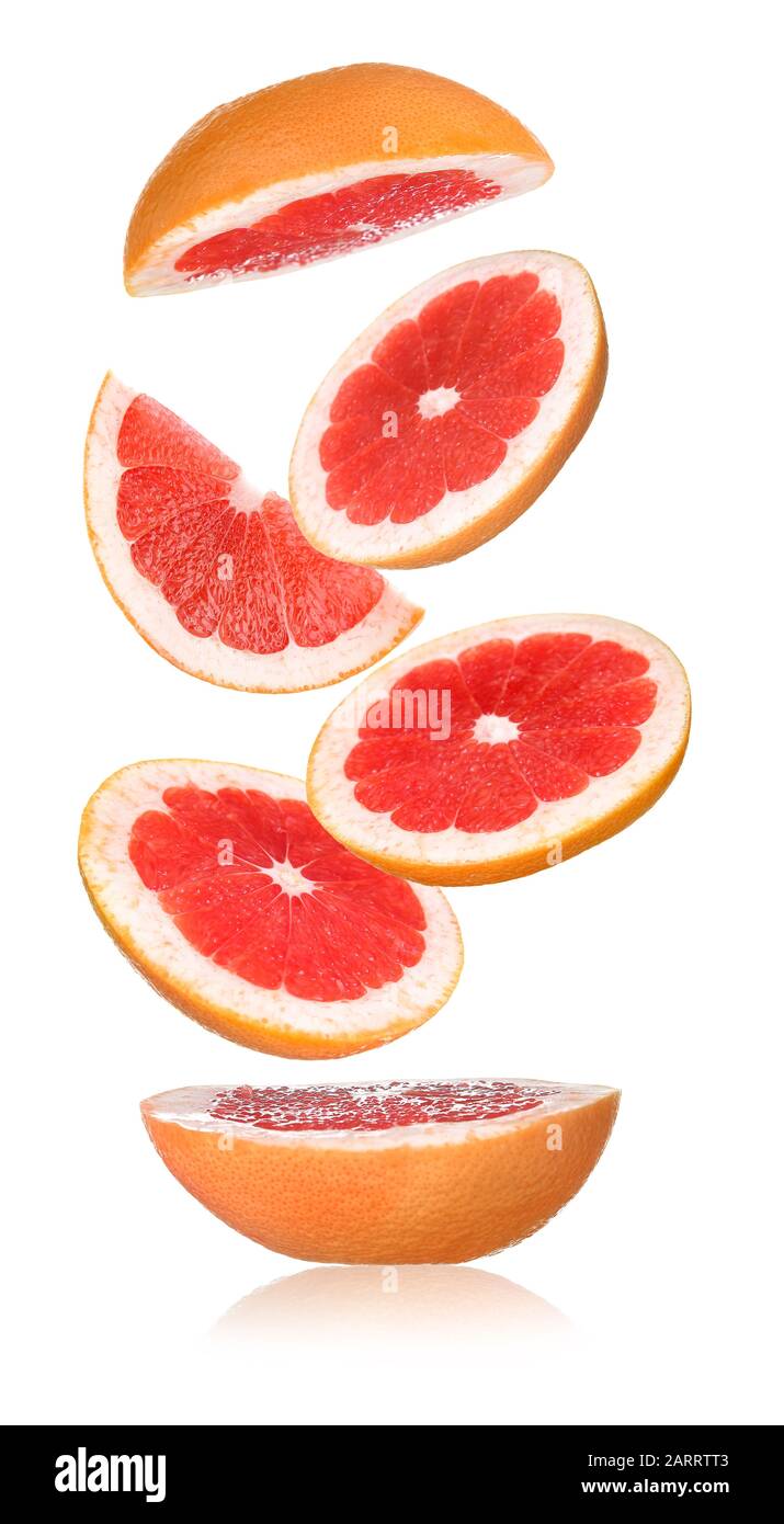 Flying cut grapefruit on white background Stock Photo