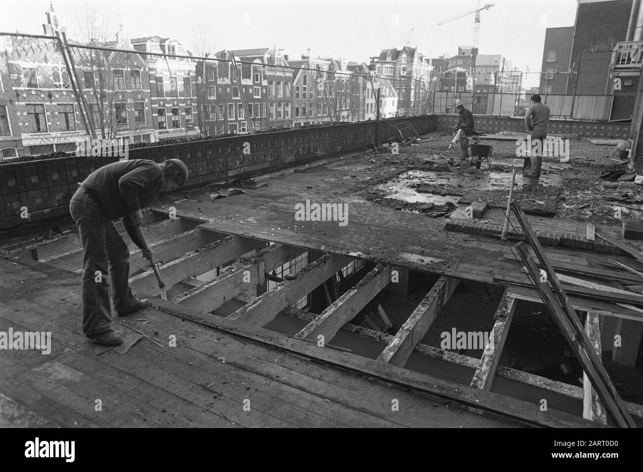 Demolition Grote Wetering started, demolition roof at the rear of the building Date: December 3, 1980 Location: Amsterdam, Noord-Holland Keywords: demolition, buildings Stock Photo