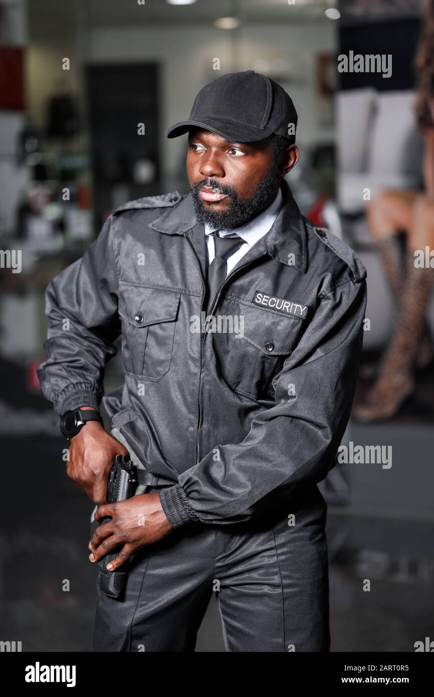 African-American security guard working in building Stock Photo - Alamy