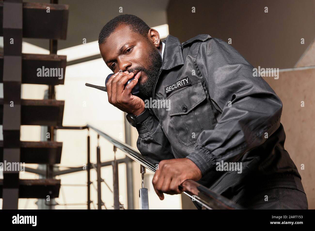 African-American security guard working in building Stock Photo - Alamy