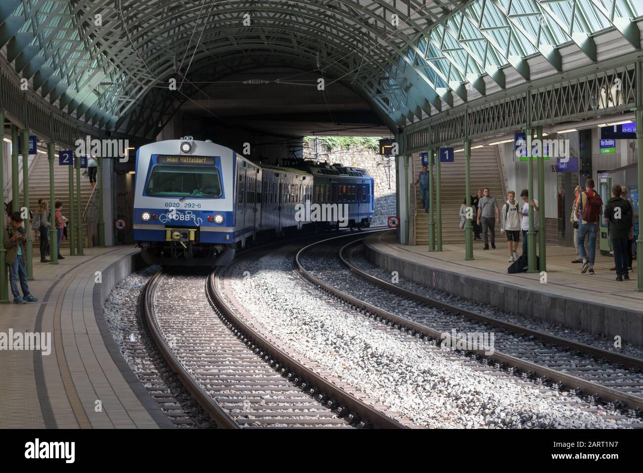 Vienna, Austria - September 3, 2019: People waiting at underground tube platform for train arrives Stock Photo