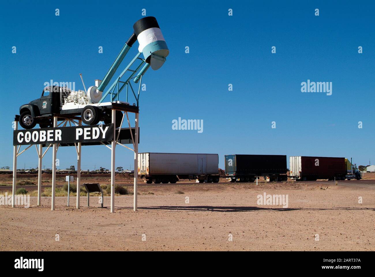 Australia, landmark with mining equipment named Blower and truck named Road Train on Stuart Highway in Coober Pedy Stock Photo