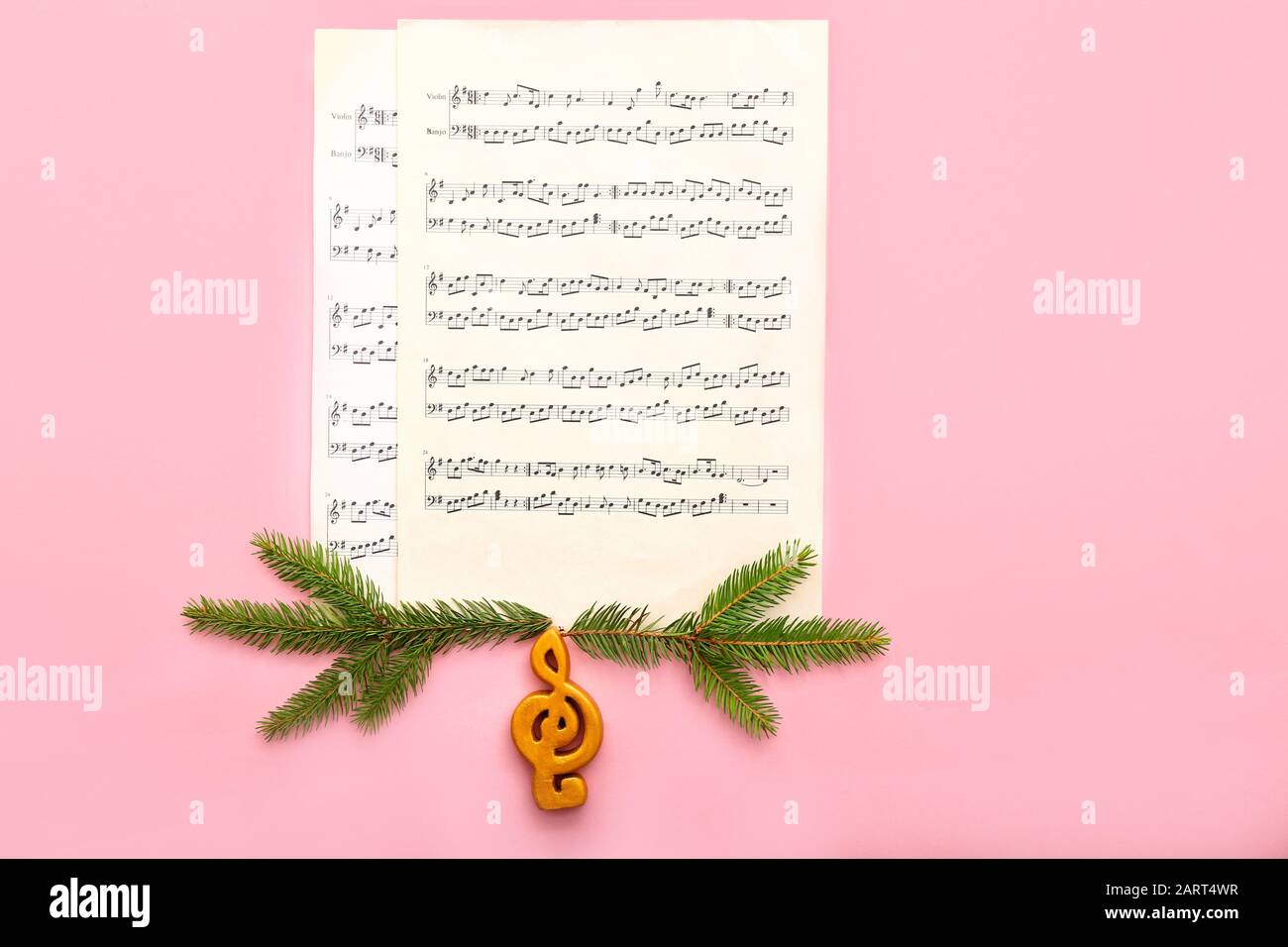 Note sheets and Christmas decor on color background Stock Photo