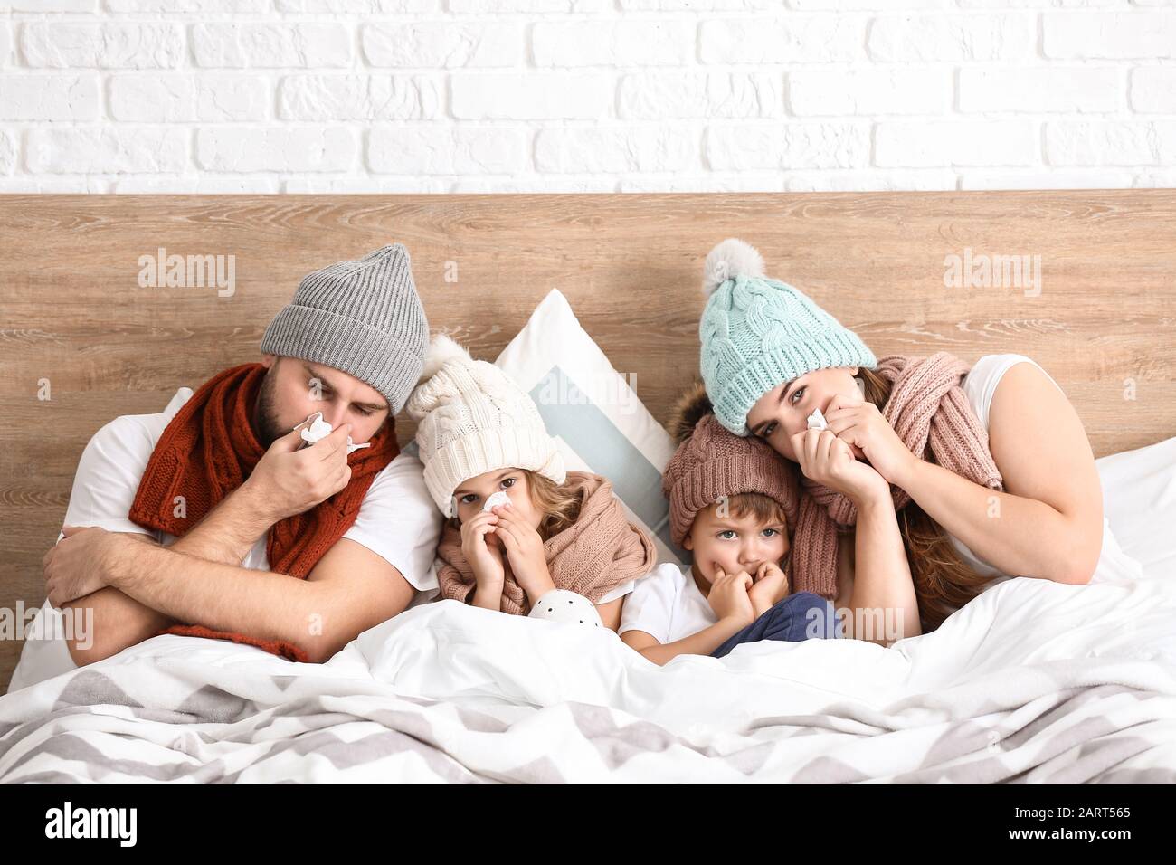 Family ill with flu in bed at home Stock Photo Alamy