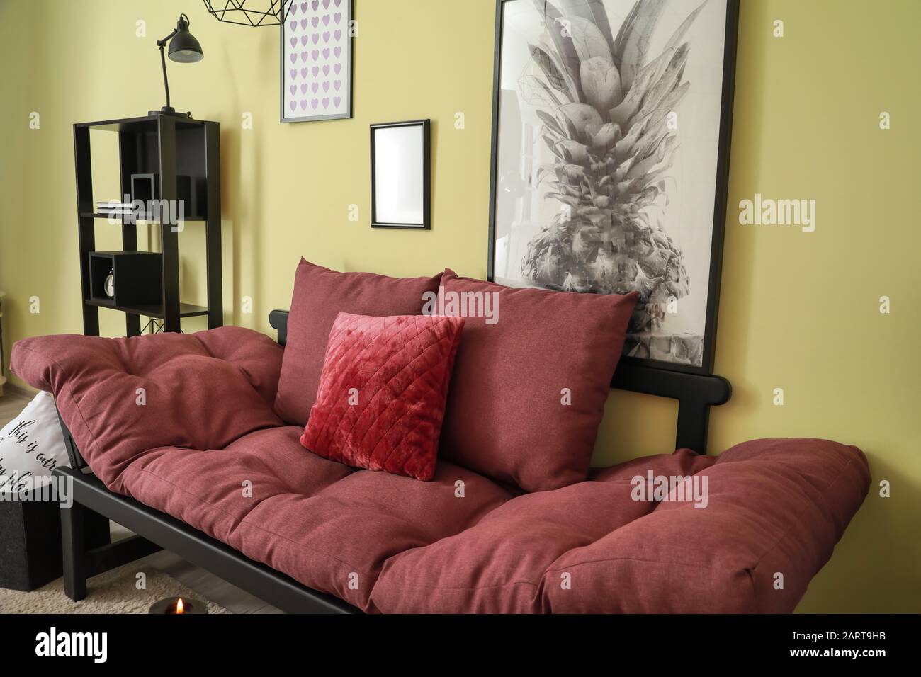 Stylish sofa in interior of living room Stock Photo - Alamy