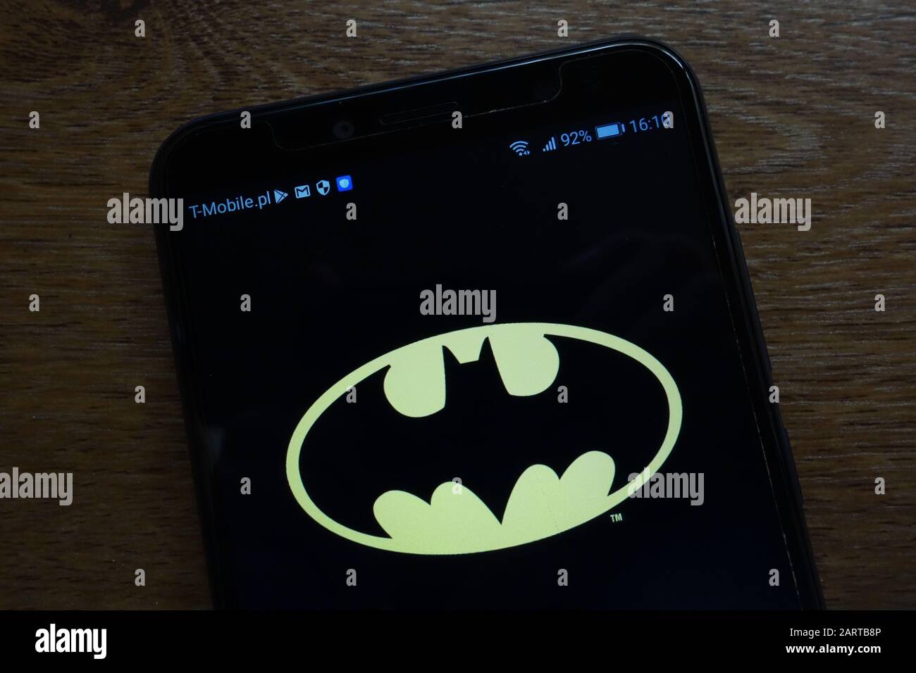 Batman logo displayed on a modern smartphone Stock Photo