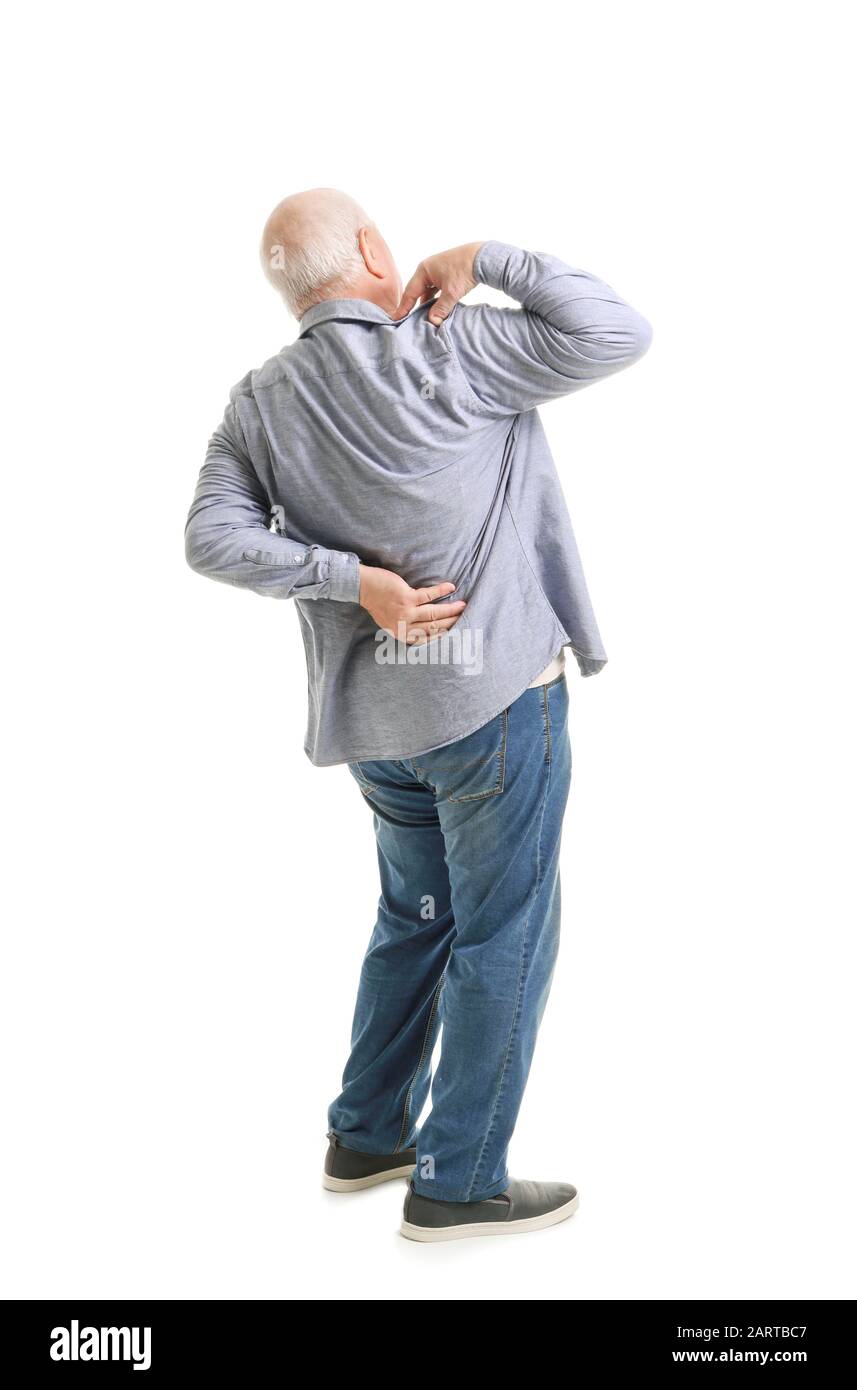 Senior man suffering from back pain on white background Stock Photo - Alamy