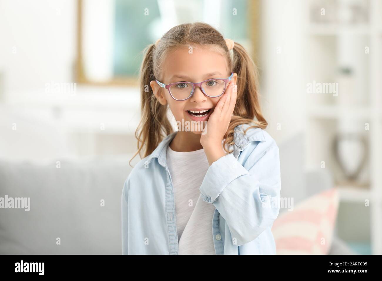 Cute little girl at home Stock Photo - Alamy