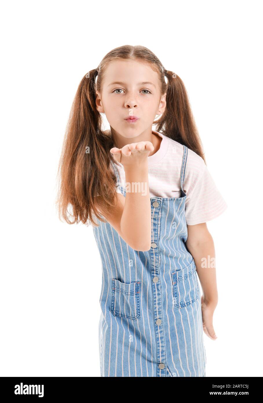 Cute little girl blowing kiss on white background Stock Photo Alamy