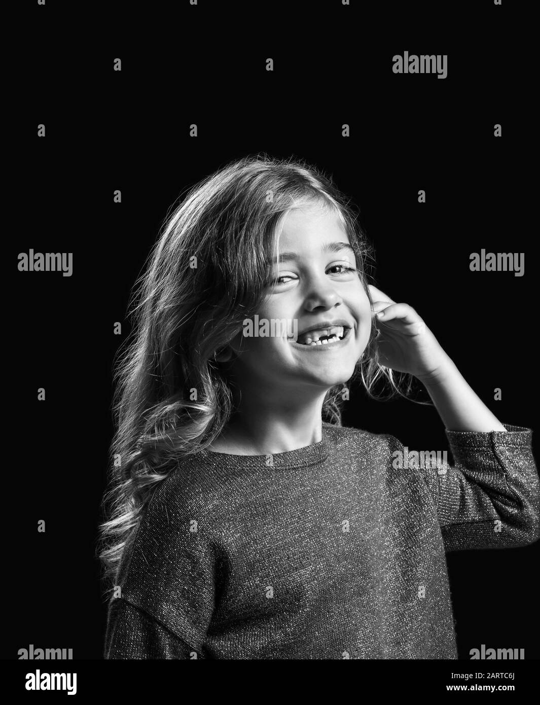 Black and white portrait of happy little girl on dark background Stock ...