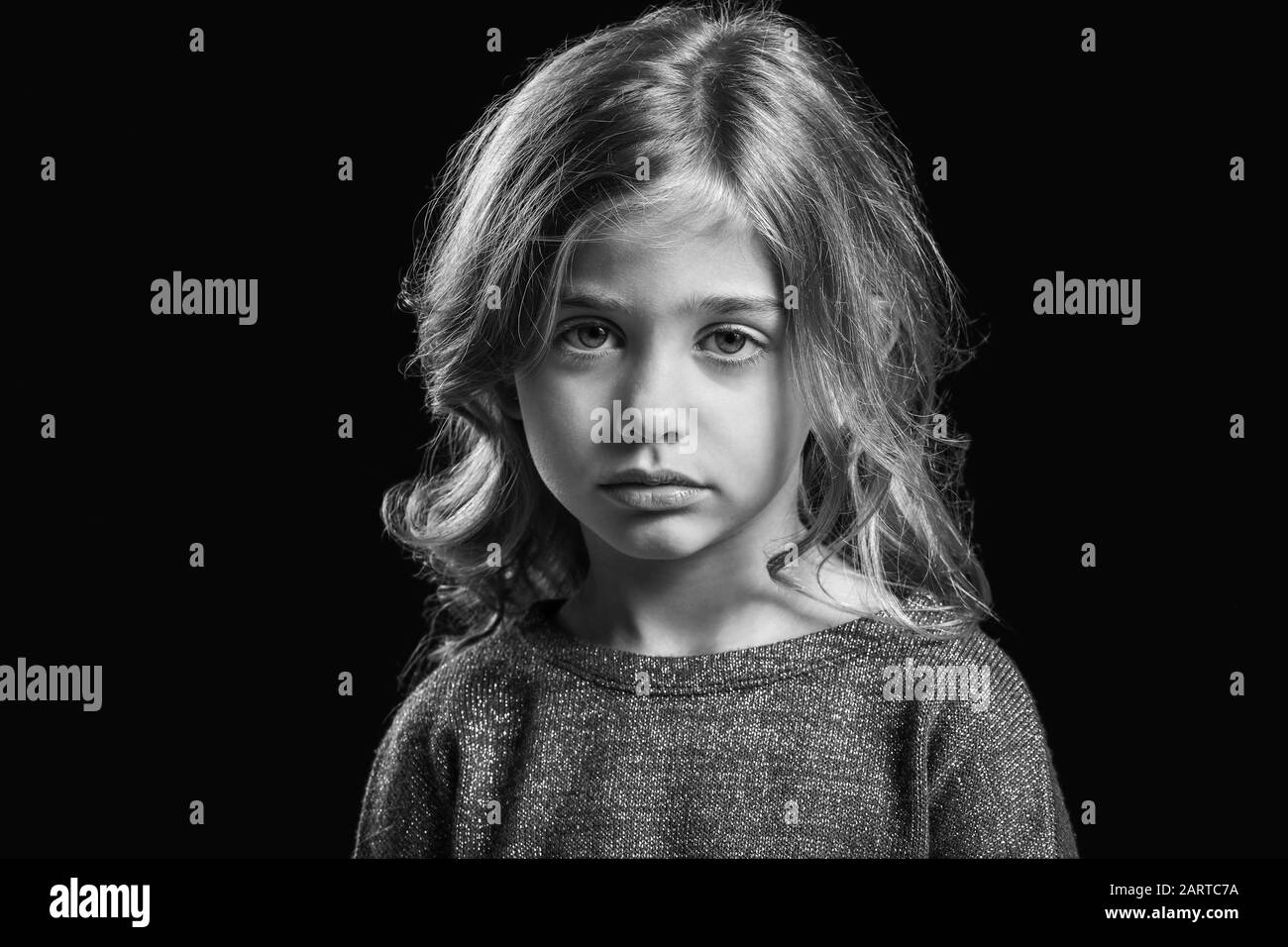 Black and white portrait of sad little girl on dark background Stock Photo  - Alamy