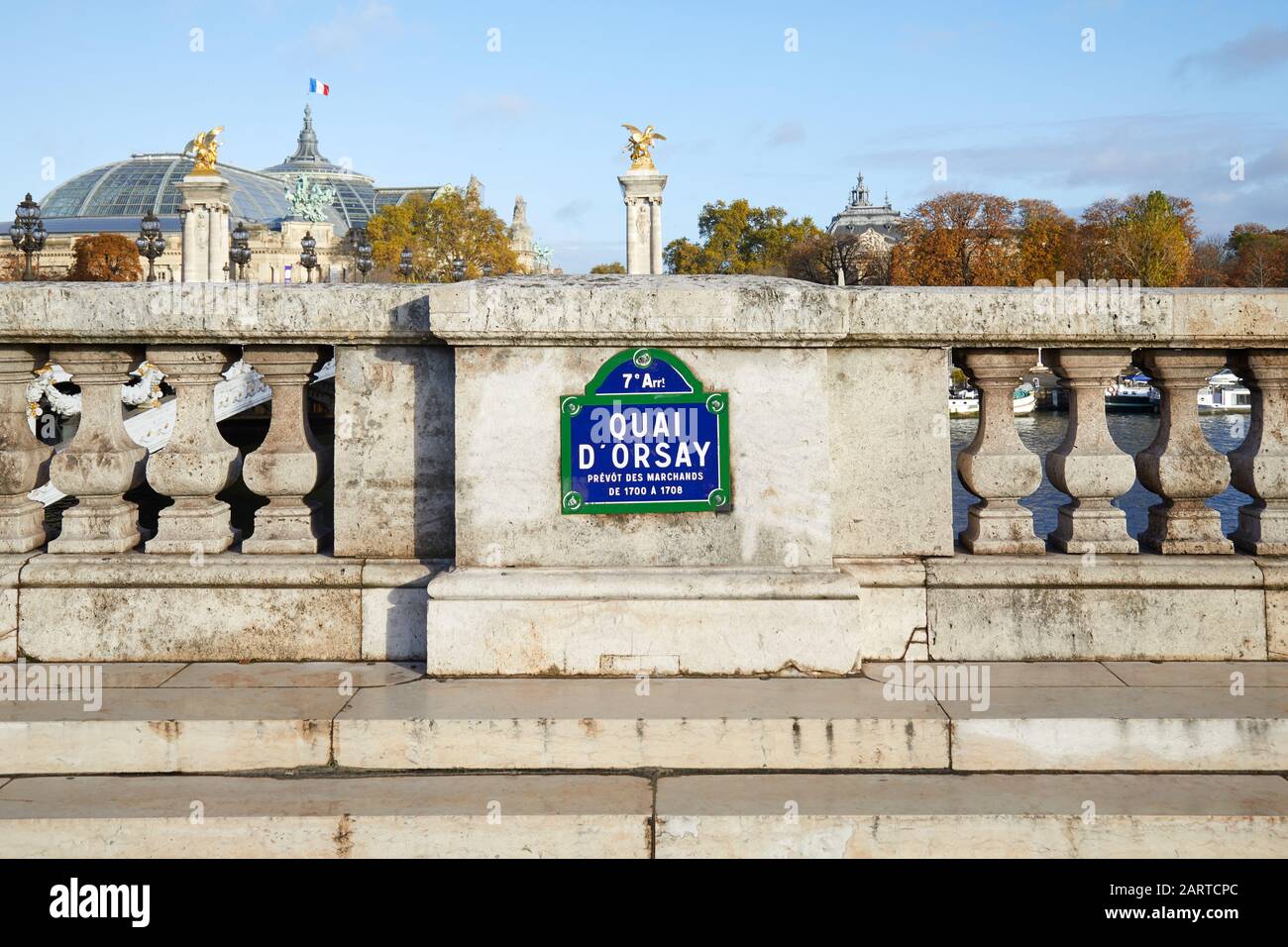 Quai Orsay typical street sign and stone balustrade with Grand Palais view in Paris, France Stock Photo