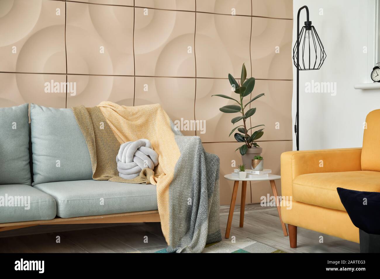 Stylish interior of living room with sofa Stock Photo - Alamy