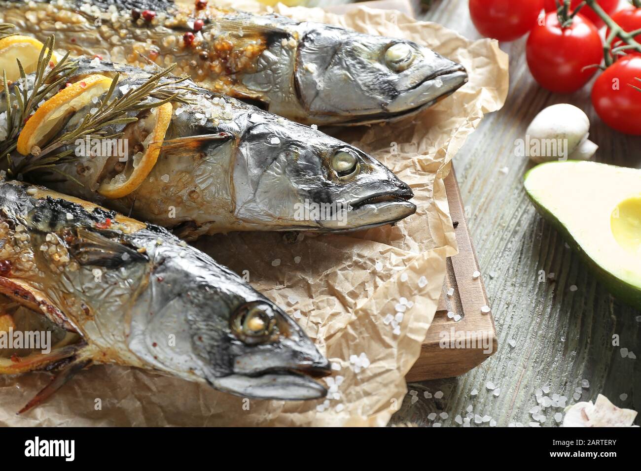 Baked mackerel fish on wooden table Stock Photo Alamy