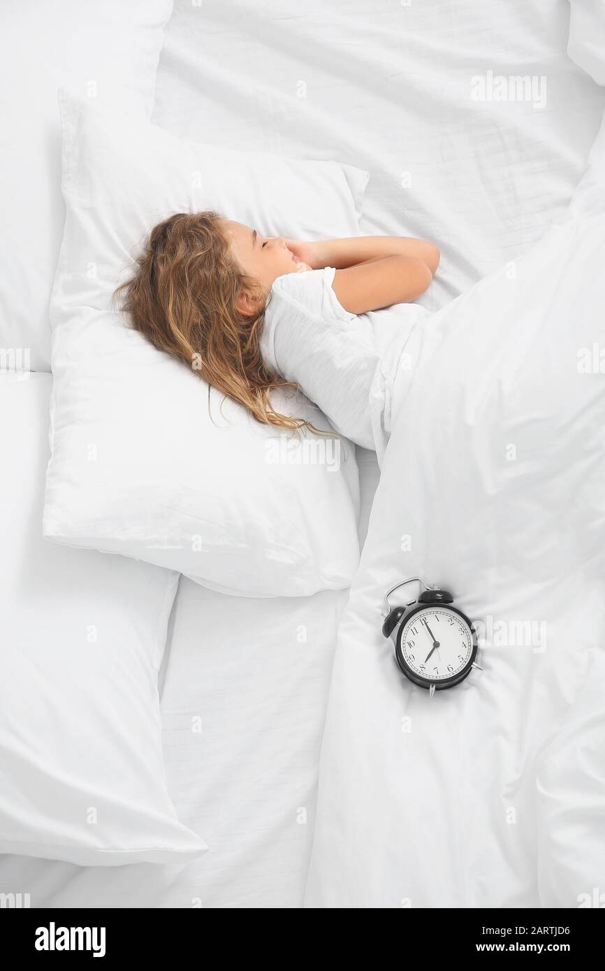 Cute little girl sleeping in bed Stock Photo Alamy