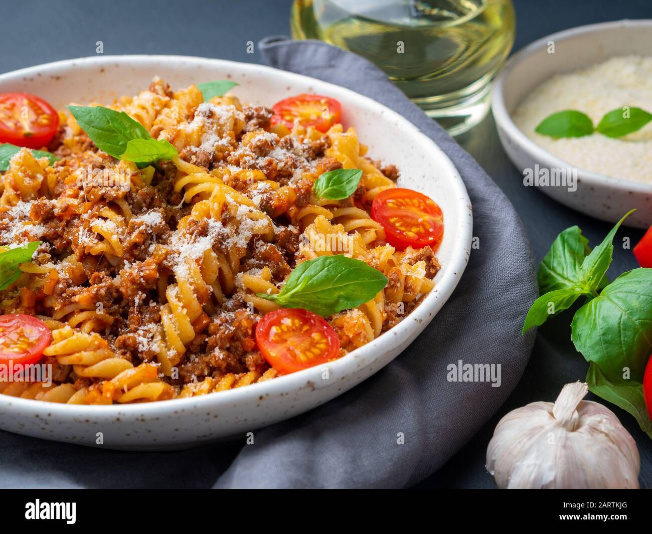 Bolognese pasta. Fusilli with tomato sauce, ground minced beef, basil
