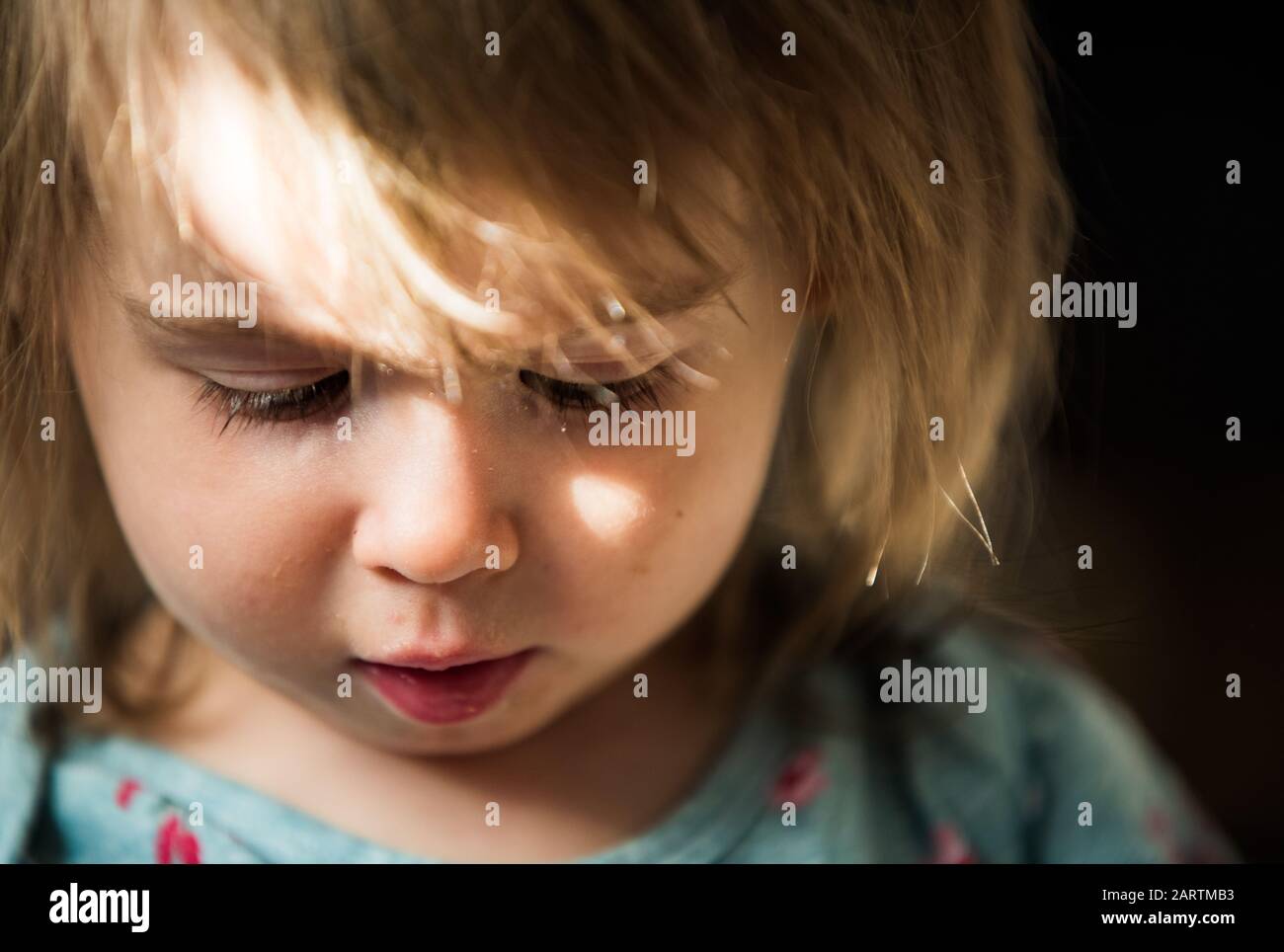 Portrait of very sweet little child with big eyes. 2 year old baby girl Stock Photo