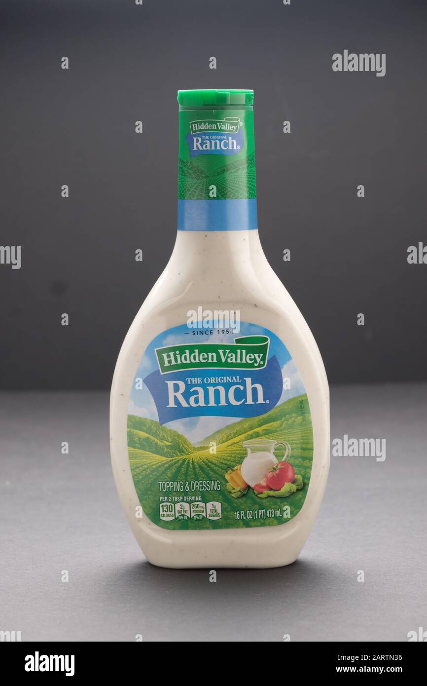 Plastic squeeze bottle of ranch salad dressing on dark background Stock Photo