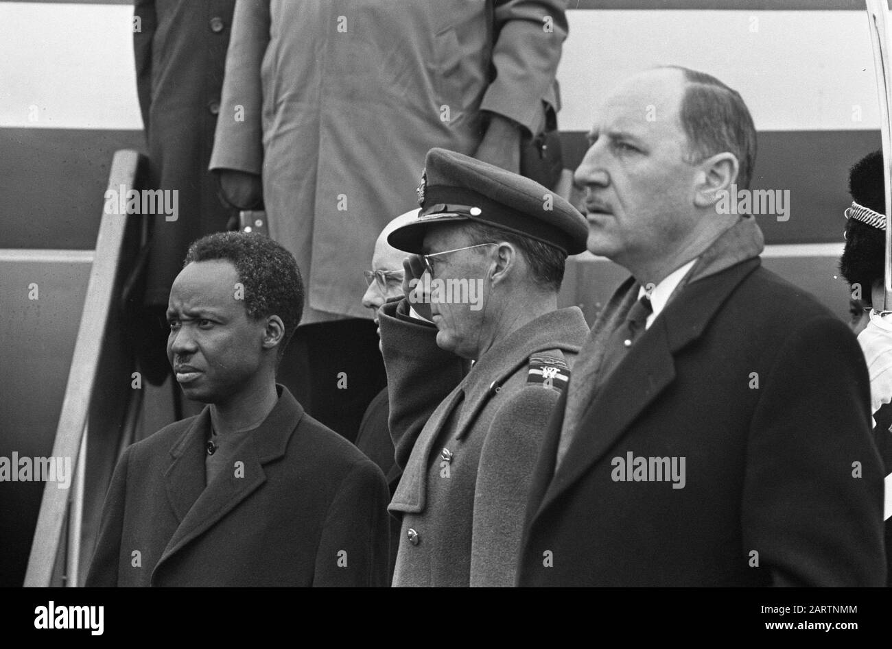 State visit President Nyerere of Tanzania. At Soesterberg airport while playing the national anthem, flnr Nyerere, Prins Bernhard and Minister Luns Date: 21 april 1965 Location: Soesterberg, Utrecht Keywords: ministers, presidents, princes, state visits, airfields Personal name: Bernhard (prince Netherlands), Luns, J.A.M.H., Luns , Joseph, Nyerere, Julius Stock Photo