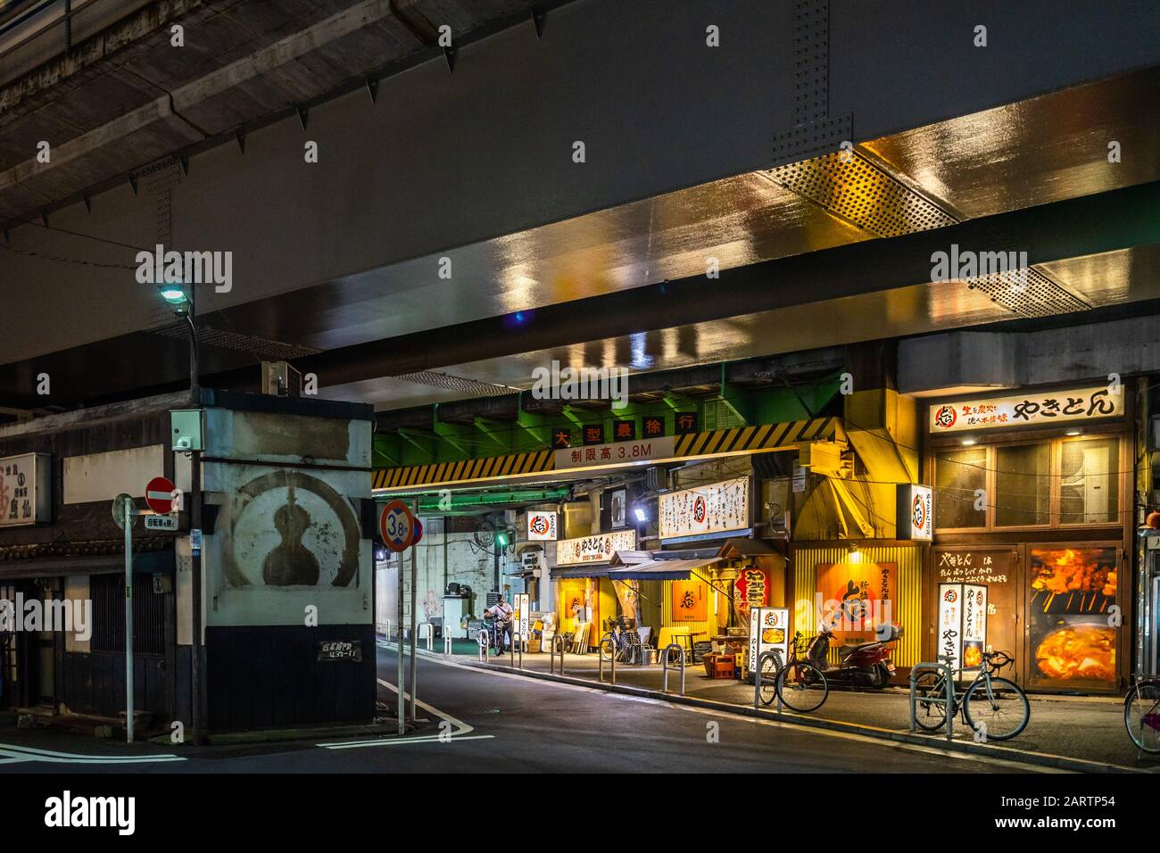 Tokyo, Japan, August 2019 - Yurakucho's restaurants under the train tracks are specialized in yakitori (grilled chicken skewers) Stock Photo