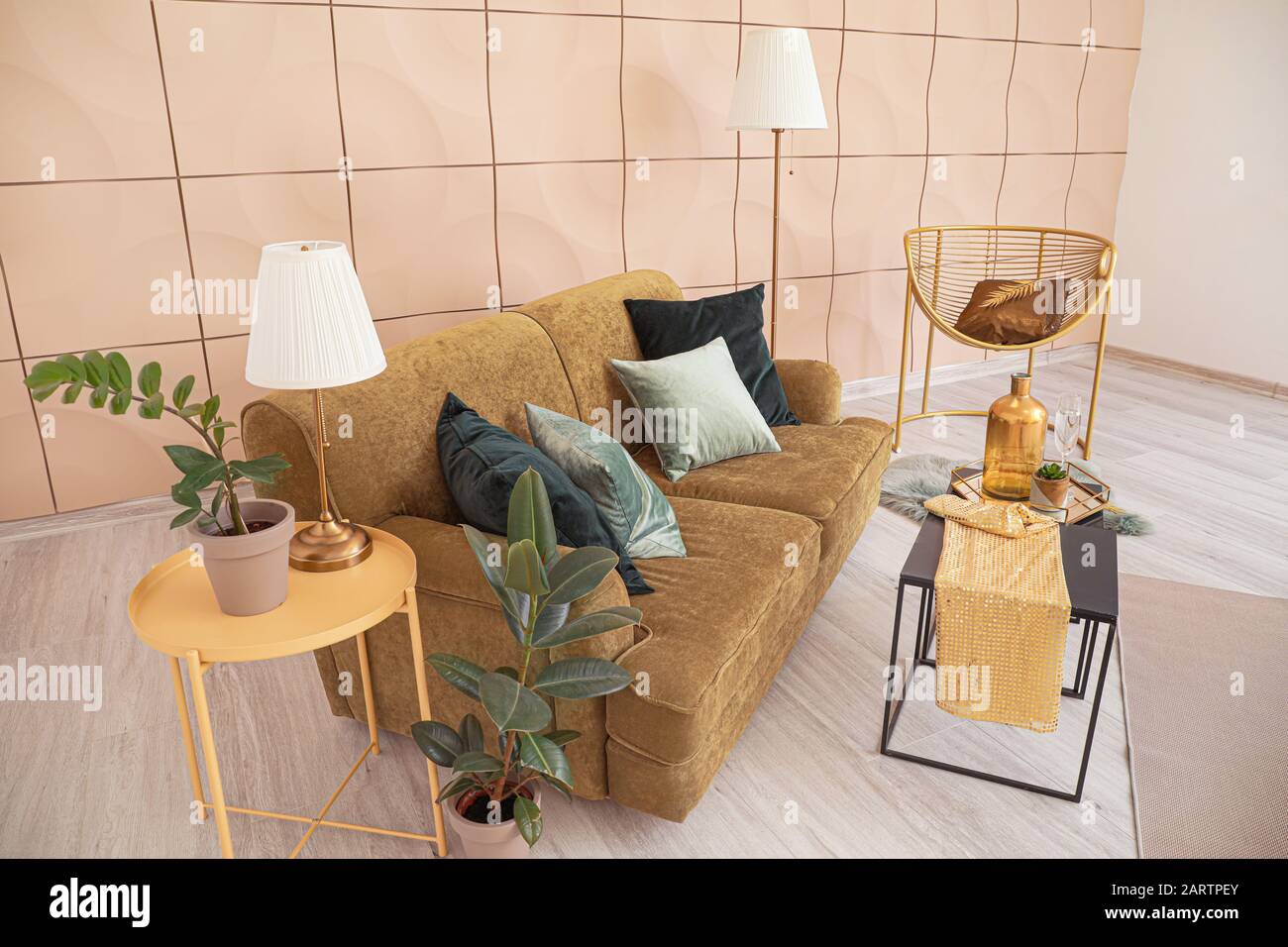 Stylish interior of living room with comfortable sofa Stock Photo - Alamy